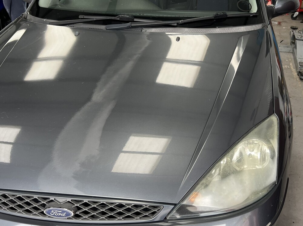 car bonnet showing half polished and half not polished