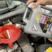 adding engine oil to a Ford engine