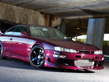 A front right shot of a maroon Nissan S14 200SX